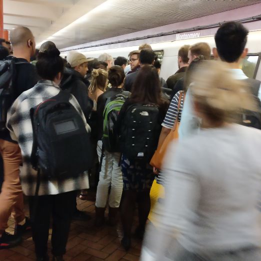 People forgetting queues in a popular metro station